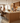 PTMD Fal Low barstoel, bruin fluweel met zwart metalen onderstel, set van 2
